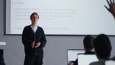 teenager presenting coding project in class