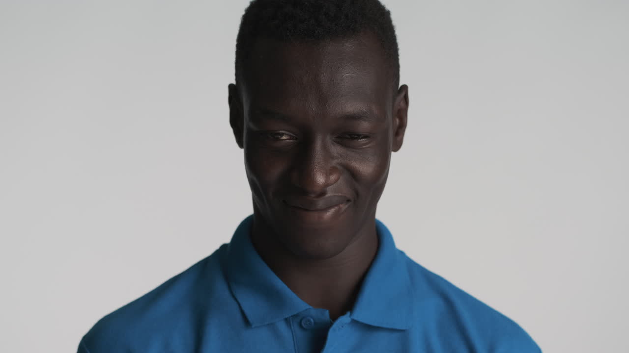Arrogant African american man on grey background.