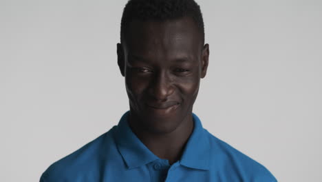 arrogant african american man on grey background.