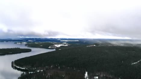 drone shot of a snowy landscape in sweden.