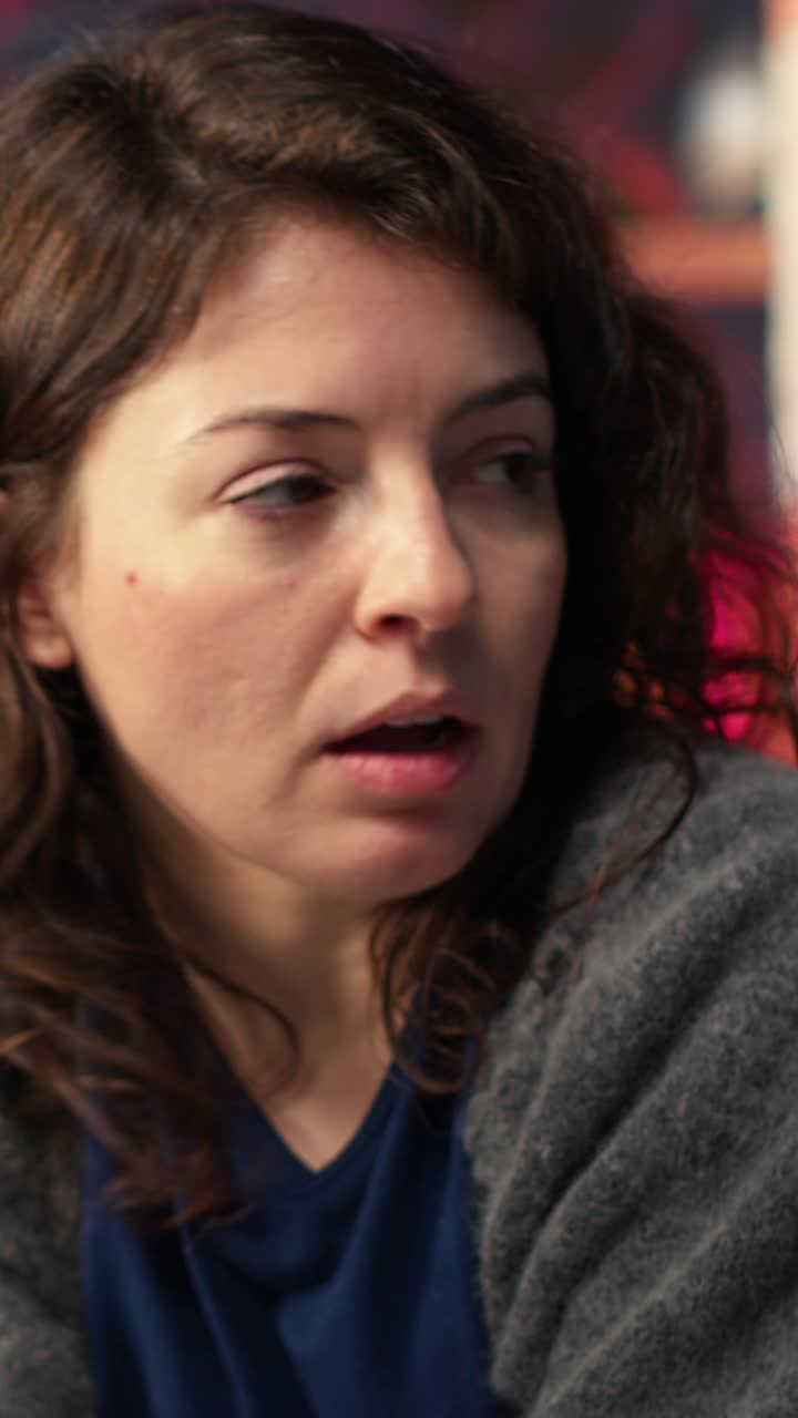 Vertical Video Man and woman watching business conference infographics on computer setup