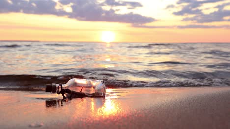 message in the bottle against the sun setting down