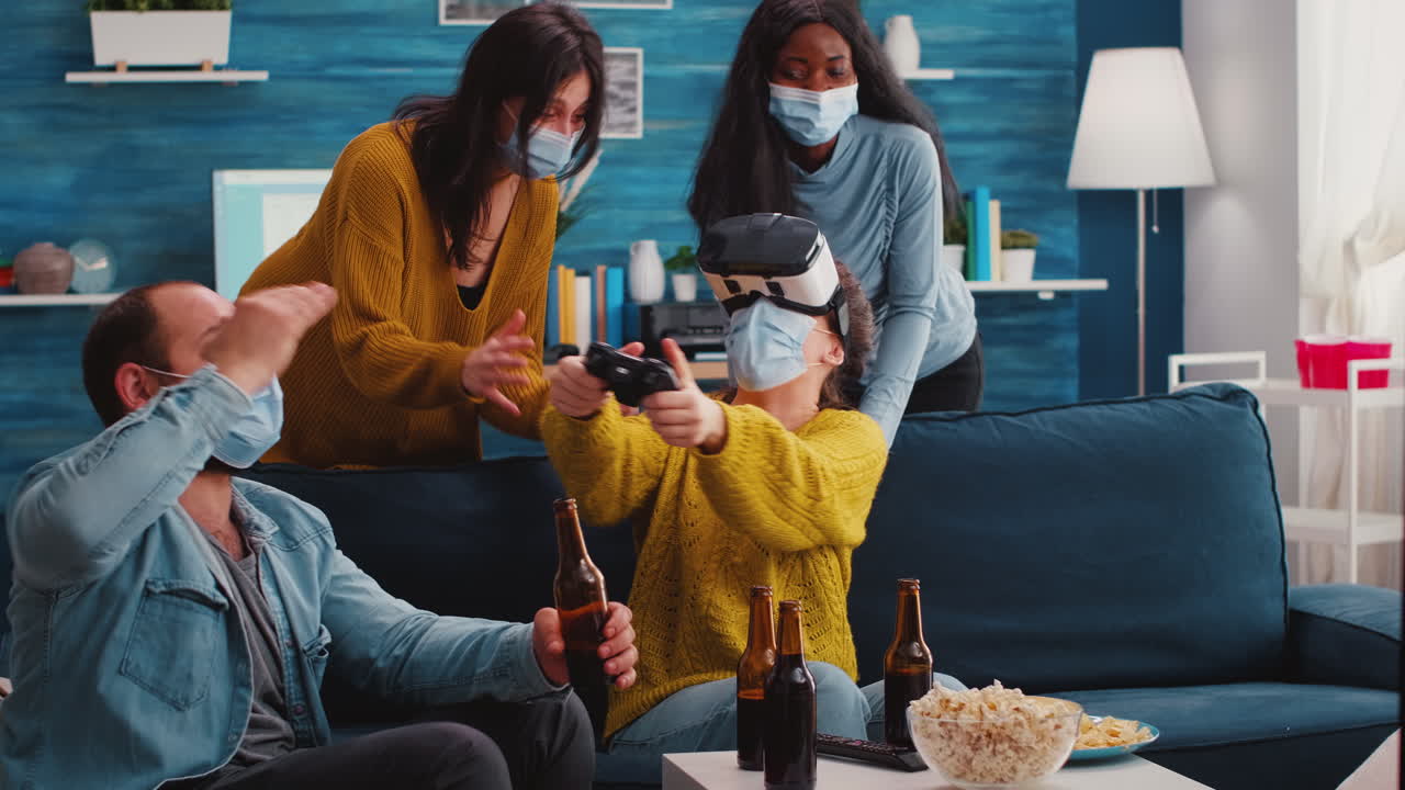 Multiethnic friends having fun playing video game with vr headset