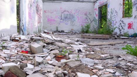 abandoned building interior with graffiti and debris