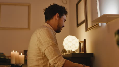 man playing piano indoors