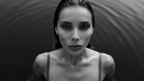 serene black and white portrait of woman in water