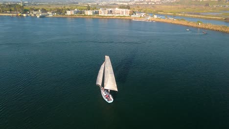 Sailboat-Cruising-In-The-Calm-Blue-Waters-Of-Marina-Del-Rey-In-Los-Angeles,-California,-USA