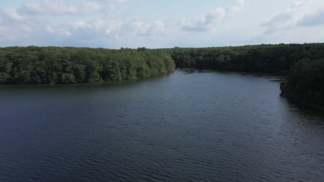 Flyover-French-Trémelin-or-Tremelin-lake-in-Brittany,-France