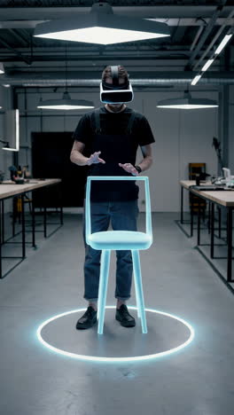 man in vr headset interacting with a virtual chair in a tech lab