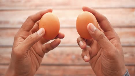 hands holding eggs