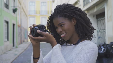 beautiful african american woman with photo camera.