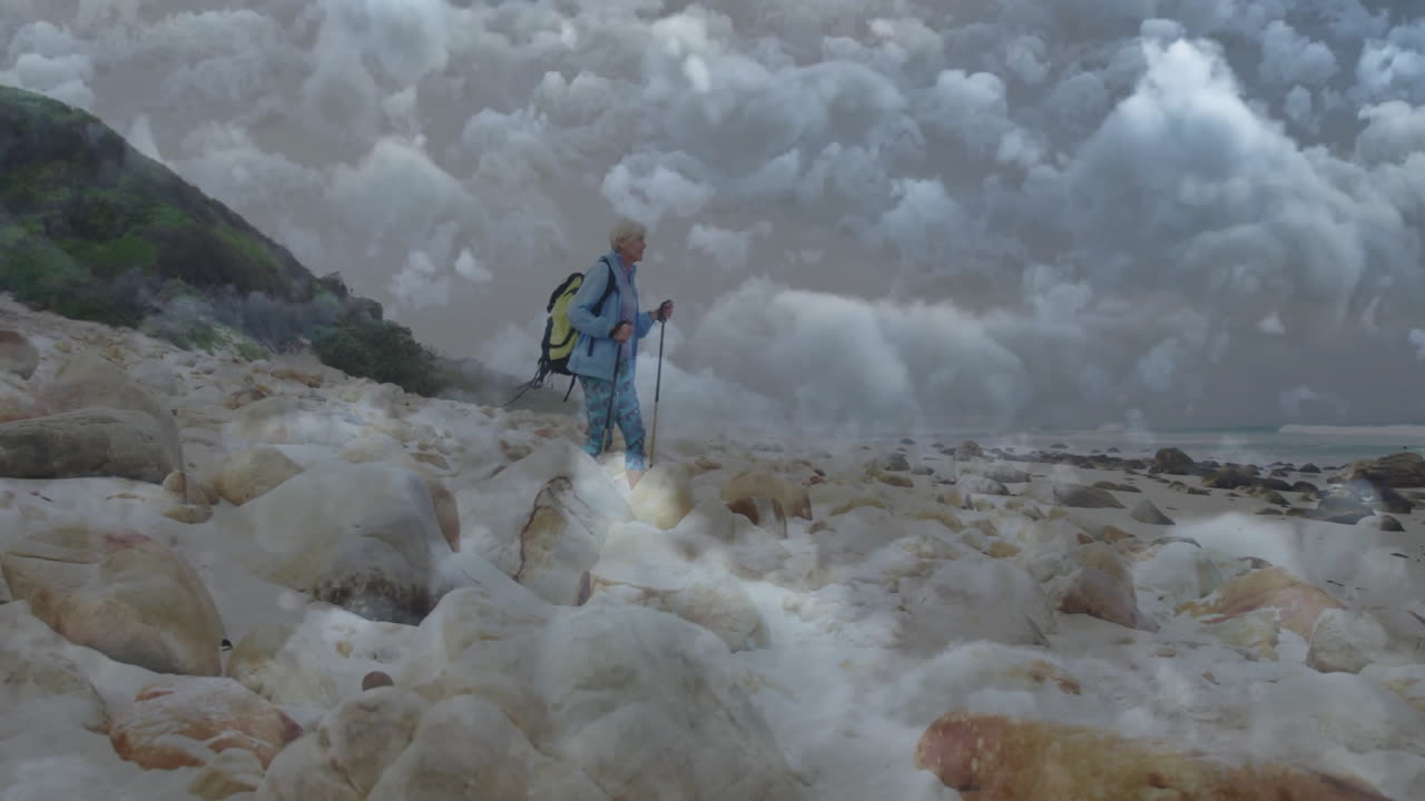 woman hiking along rocky coast, displaying animated elevation graph and travel route icons