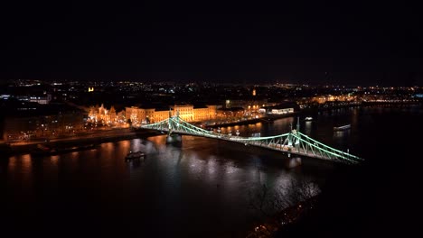 nightlife, cityscape with a bridge at budapest, ship on the river