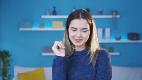 cheerful and happy young woman makes sign expressing that everything is fine and well.