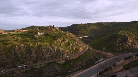 view over the grassy hills ans valley of river tajo at toledo, spain