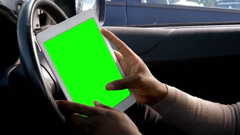 Mans hands using a tablet