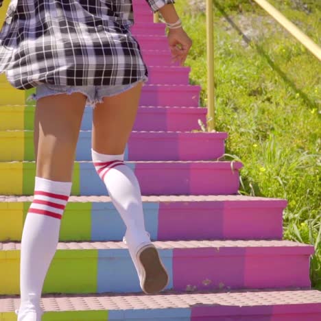 young woman running up the stairs