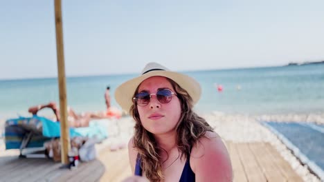 greek seaside leisure: tourist relaxing by the water