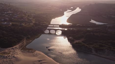 Scenic-sunset-at-the-Msimbazi-river-at-the-Illovo-beach-in-Durban-in-South-Africa-,-orbiting-shot