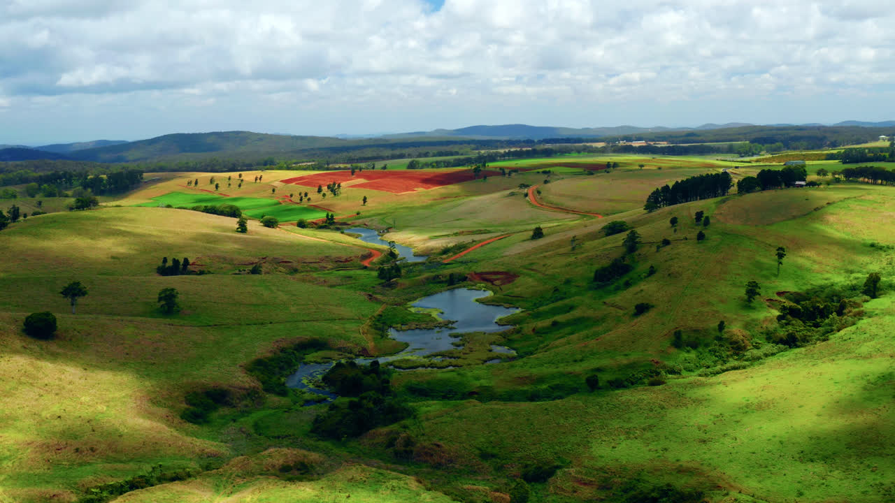 Creeks And Lush Fields In The Countryside Of Atherton Tablelands, Queensland, Australia - aerial drone shot
