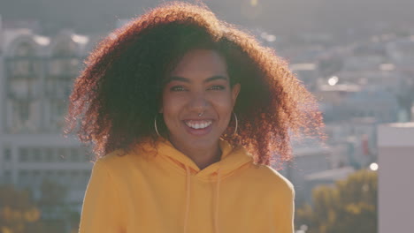 portrait beautiful african american woman blowing kiss laughing enjoying summer lifestyle on rooftop at sunset