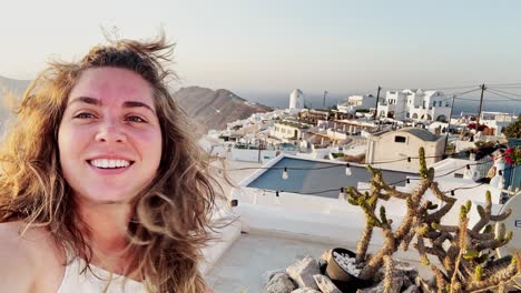 Young Woman Enjoying Santorini Sunset with Village Charm