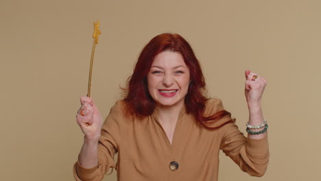 happy woman with a golden wand