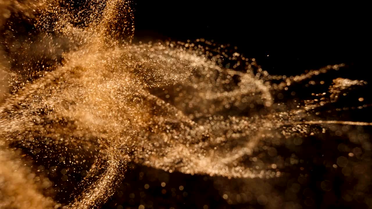 Elegant, detailed, and golden particles flow with shallow depth of field underwater