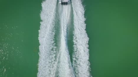 The-yacht-moves-through-the-waves,-leaving-behind-white-traces-of-foamy-splashes