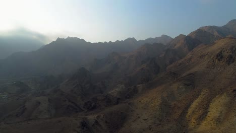 Aerial---Cinematic-shot-of-a-mountain-in-Hatta