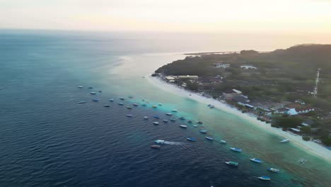 Aerial-over-Gili-Trawangan-Beach,-Indonesia,-an-slice-of-tropical-heaven-that-beckons-travelers-with-its-tranquil-beauty-and-serene-charm