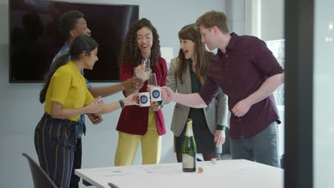 business team toast champagne at work