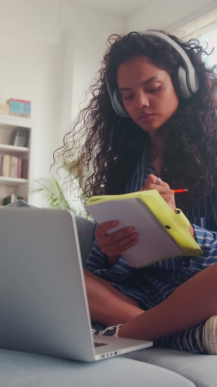 Studying at home with focus and determination in a cozy setting