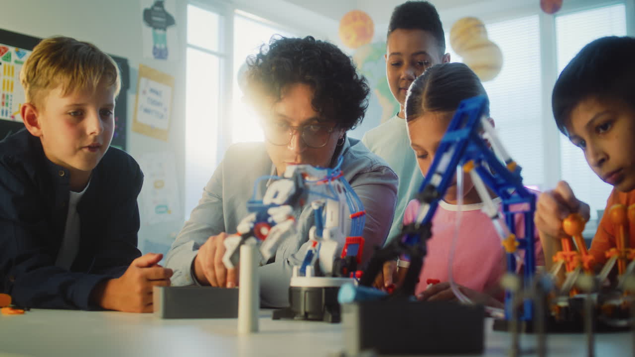 Students and Teacher Working on Robotics Project in Classroom