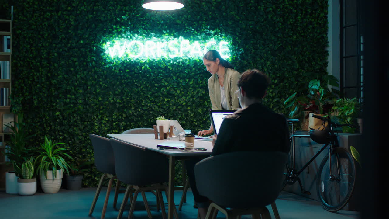 young business woman working late colleagues brainstorming creative ideas discussing project deadline collaborating planning successful strategy in trendy startup office workspace