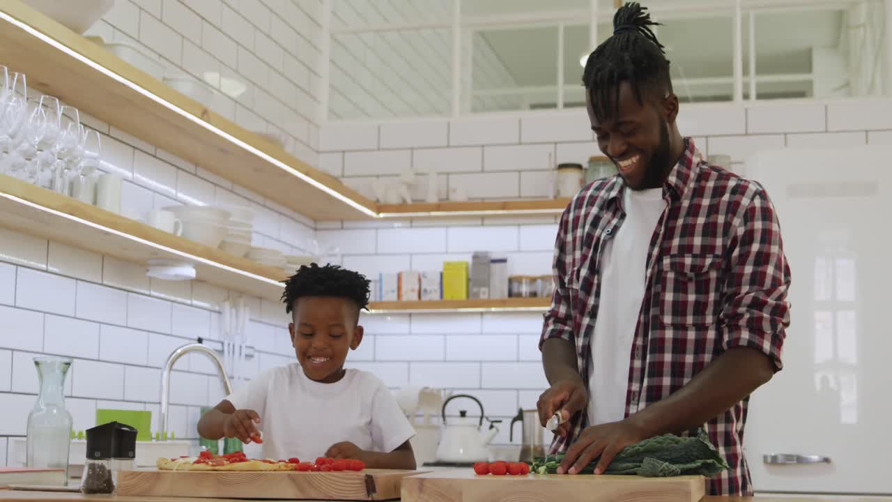Father and son cooking together