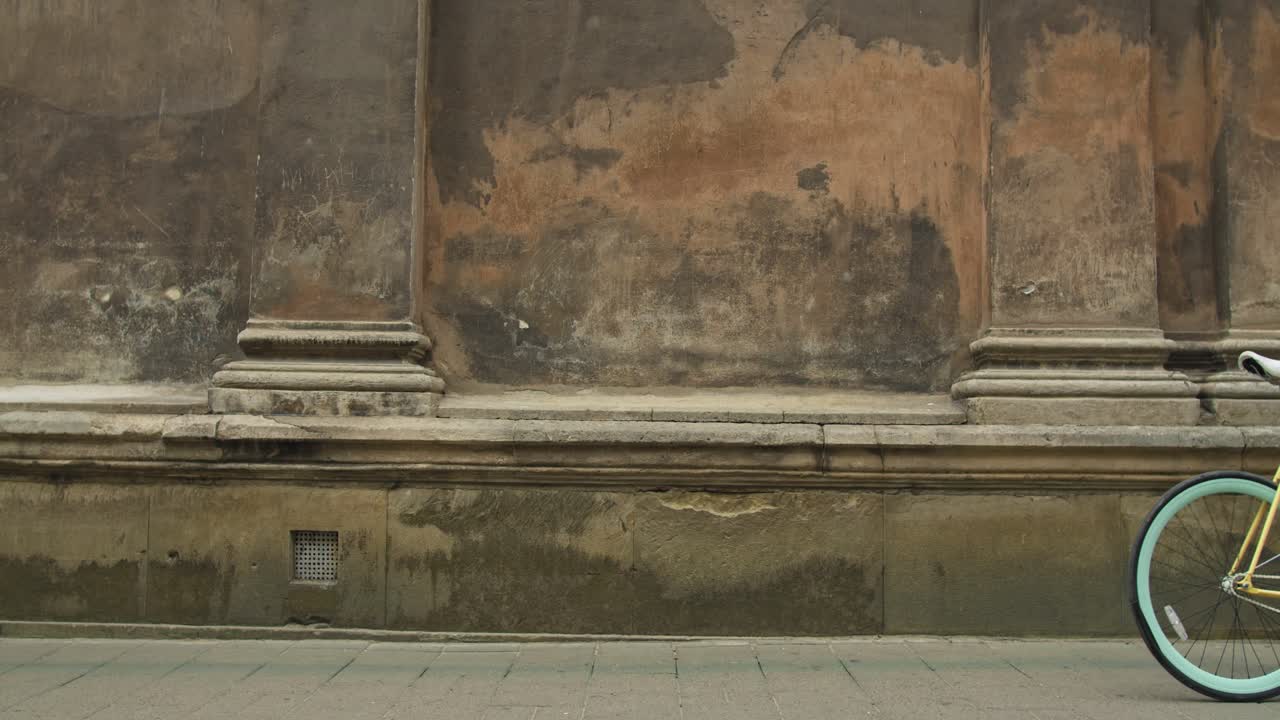 Man with Bicycle in Urban Environment