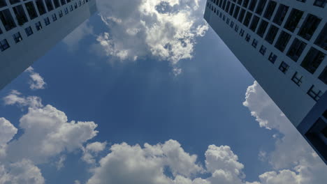 Color-Time-Lapse-of-Residential-Architecture-4k-Color-Time-Lapse-from-low-angle-looking-up-to-dramatic-clouds-moving-upward-through-the-scene