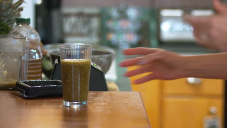 kitchen scene with a smoothie being made