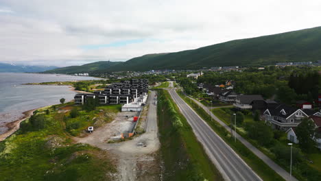 tromso neigborhood next to fjord, aerial down tromsøysundvegen e8