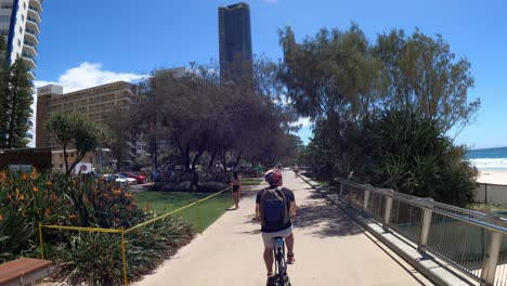 people enjoying a sunny day in a coastal park