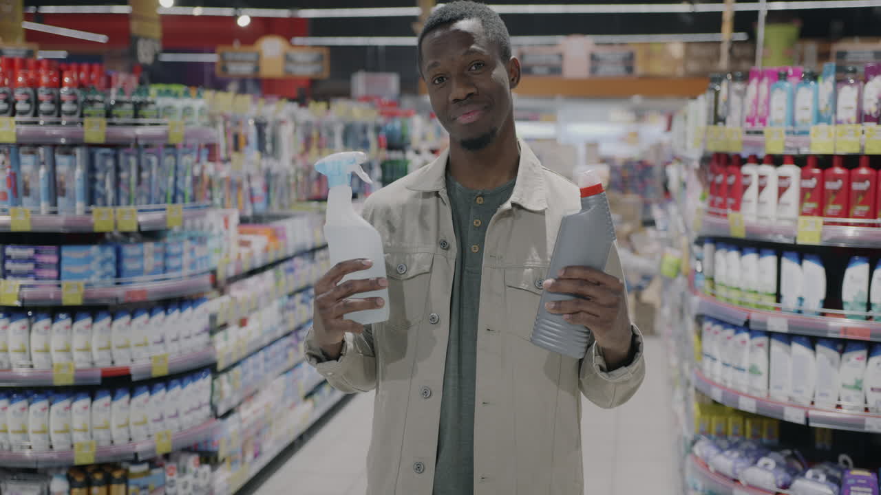 Man Shopping for Cleaning Supplies in a Supermarket