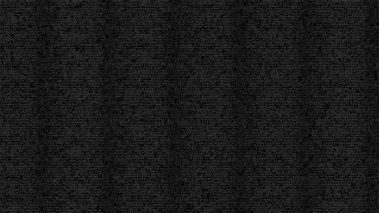 Detail textury tmavě černé látky.