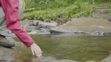 woman by a creek