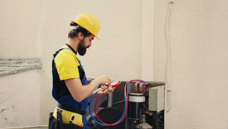 repairman calibrating pressure device