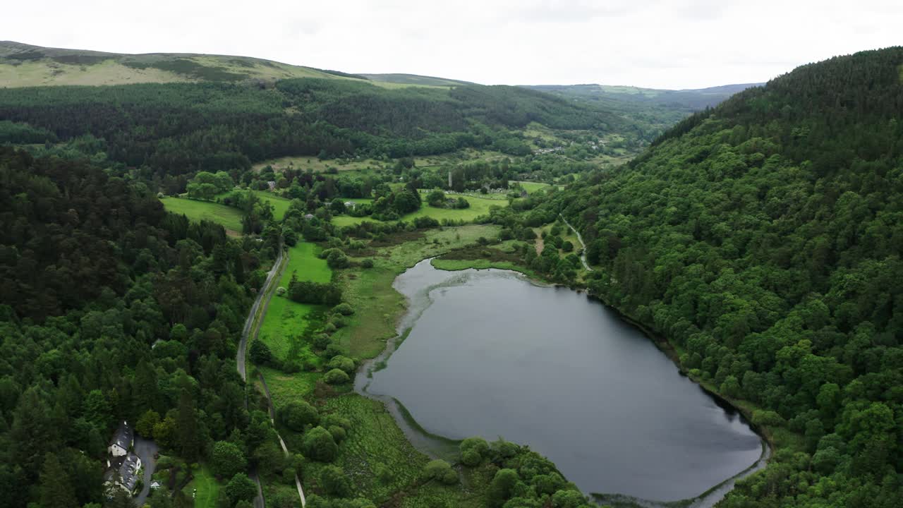 Aerial view of forests surrounding Ireland's rural Glendalough Upper Lake.
