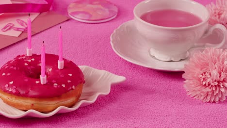 pink birthday donut and tea