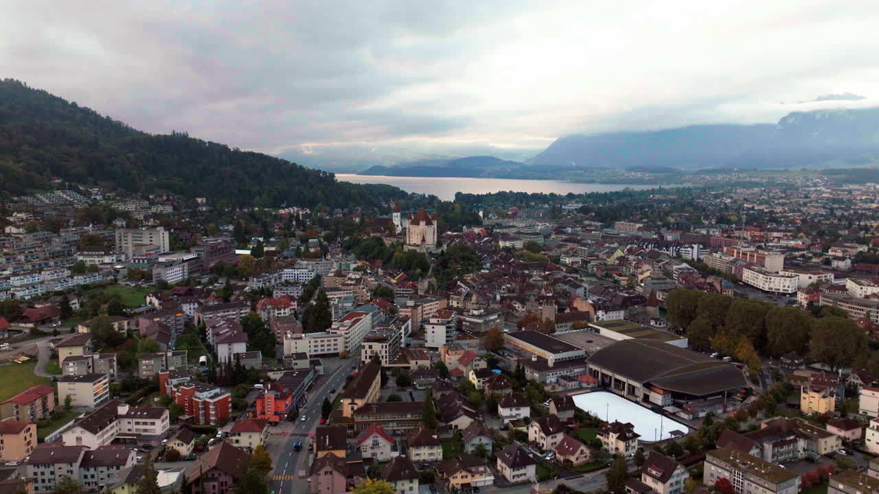 Downtown Thun Switzerland cars Swiss village city downtown stunning Thun Castle Dukes of Z&auml;hrigen Interlocken Bern Jungfrau cloudy sunrise sunset aerial cinematic drone circle left slowly movement