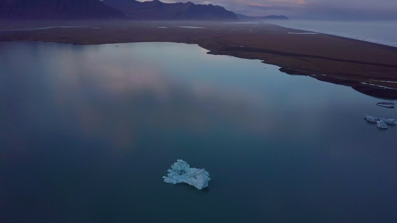 Iceberg in Icelandic Lake at Sunset