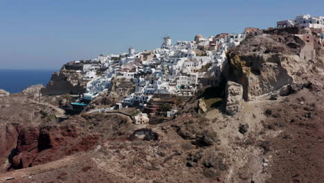 White-Architecture-Of-Oia-Village-On-Santorini-Island,-Greece---aerial-drone-shot